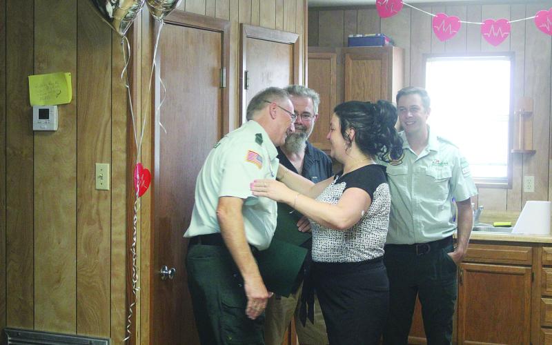 Katrina Hackney (front right) greets Paramedic Mark Dupont (front left) during a patient reunion held Tuesday, August 26. Also pictured are Paramedic Dustin Soileau (back right) and Hackney’s husband, Rusty (back left). (Gazette photo by Tony Marks)