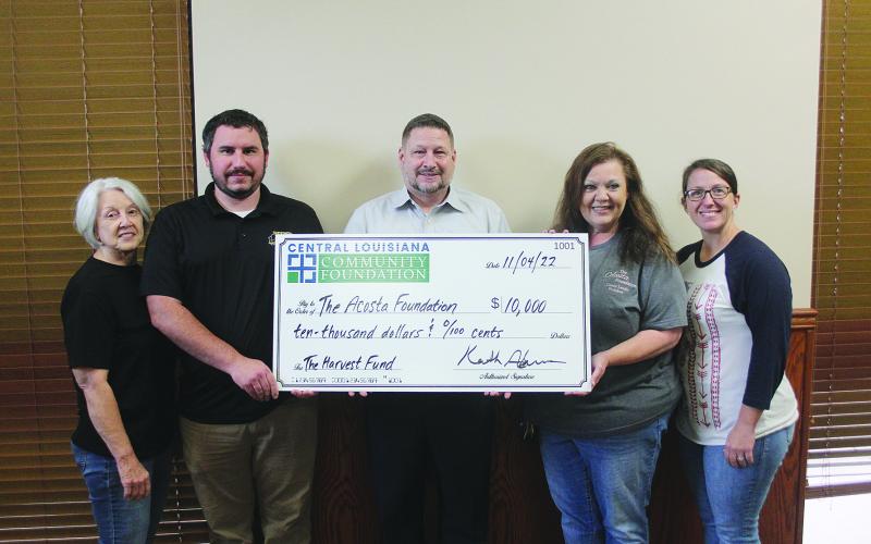 Pictured (L-R) Dr. Gwen Fontenot, Acosta Foundation board member/advisor; Luke Deville, Manager, Teet’s Food Store; Keith Adams, President &amp; CEO of Central Louisiana Community Foundation; Connie Lamke, President of the Acosta Foundation; and Heidi Jeanmard, Acosta Foundation Board Member/Secretary-Treasurer. (Gazette photo by Tony Marks)