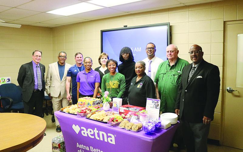 From left are (back row) Assistant Superintendent Mike Lombas, Roy Serie, Eric Fontenot, Ann Kay Logarbo, Torren LaFleur, Tommy Jones, School Board President Bobby Hamlin, and Superintendent Darwan Lazard; (front row) Amber McCoy, Maegan Moore, and School Board Vice President Sheila Joseph. (Gazette photo by Tony Marks)