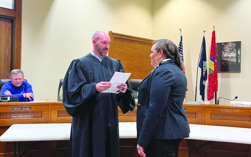 WILLIAMS IS APPOINTED JUROR - Angelica Williams (right) was sworn in by Ville Platte City Judge Greg Vidrine during the Evangeline Parish Police Jury meeting Monday evening, January 9, filling the District 8 seat left vacant by her husband, Ryan Leday Williams, the newly-sworn in Mayor of Ville Platte. (Gazette photo by Heather Bogard)