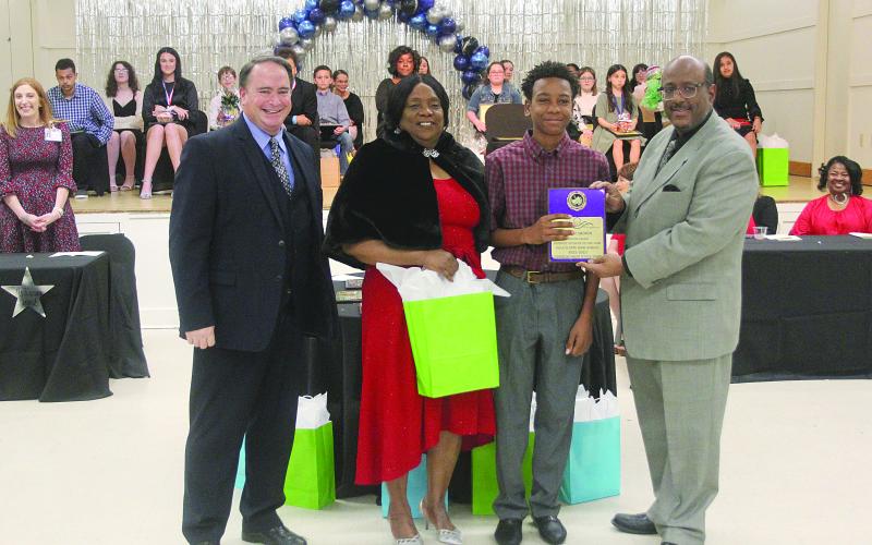 From left in the main photo are Evangeline Parish Assistant Superintendent of Schools Michael Lombas; Evangeline Parish School Board Vice President Wanda Skinner; Evangeline Parish 8th Grade Student of the Year Jayden Ardoin, of Ville Platte High; and Evangeline Parish Superintendent of Schools Darwan Lazard. (Gazette photo by Tony Marks)