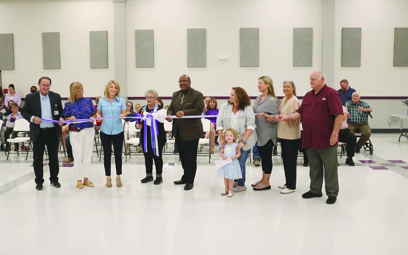 From left are Assistant Superintendent Mike Lombas, Bayou Chicot Elementary Principal Kim Soileau, State Senator Heather Cloud, former Evangeline Parish School Board Member Peggy Forman, Superintendent Darwan Lazard, Cyndi Forman with Skylar Forman, Danni O’Neill, Evangeline Parish School Board Member Monica Andrus, and Evangeline Parish School Board President Bobby Hamlin. (Gazette photo by Tony Marks)