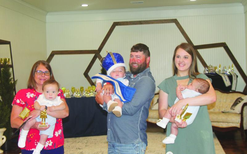 BABY MISTER COURT - Shown, from left, are the members of the Baby Mister Boggy Bayou Court. They are Korbyn Johnson, first alternate, King Tucker Chaddrick and James Fontenot, second alternate.