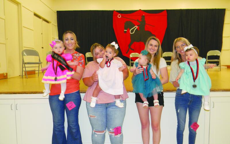 BABY MISS TOURNOI COURT - Shown, from left, are the members of the Baby Miss Tournoi Court. They are Queen Josie James Fletcher; Ella Grace Dupre, first runner-up; Vivian Aluss Orlando, second runner-up; and Vivienne Jane Brown, third runner-up.