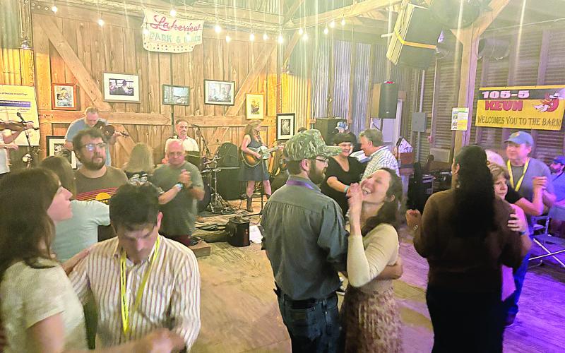 Participants and other guests dance to the band Balfa Toujours during the opening night of Dewey Balfa Cajun and Creole Heritage Week at Lakeview Park and Beach on Tuesday, March 25. Band member Christine Balfa is the daughter of Dewey Balfa. (Gazette photo by Tony Marks)
