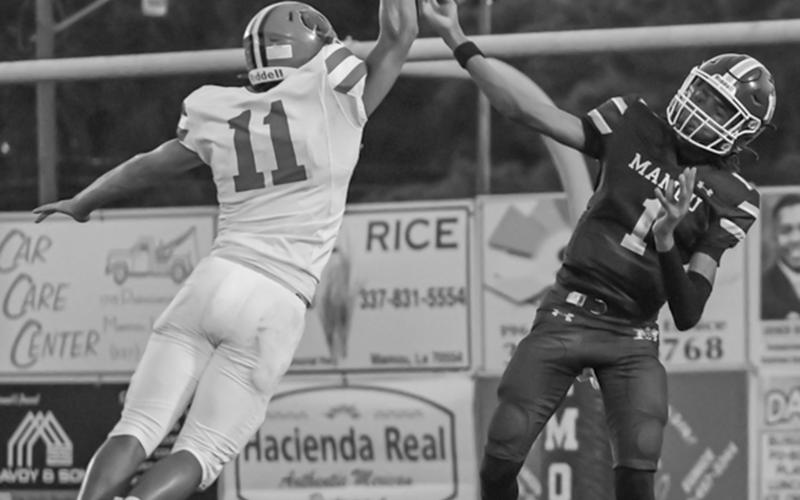 Bearcat defender Landon Istre (11) attempts to block a pass by Mamou’s quarterback Jayden Ardoin (1) during last Friday’s exciting cross-parish gridiron contest.  (Photo by Tonya Ortego)