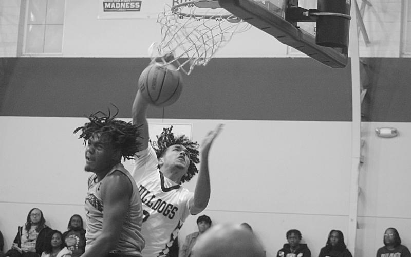 Ville Plattte’s Chavez Tezeno (2) goes up for a basket to tie the game at 32-32. The Bulldogs went on to pick up a 44-38 win over Beau Chene. (Gazette photos by Tony Marks)
