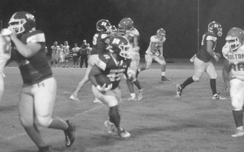 Sheamus Frank (23) runs 15 yards for a Mamou touchdown with 4:52 remaining in the first quarter against Bolton Academy. (Gazette photo by Tony Marks)