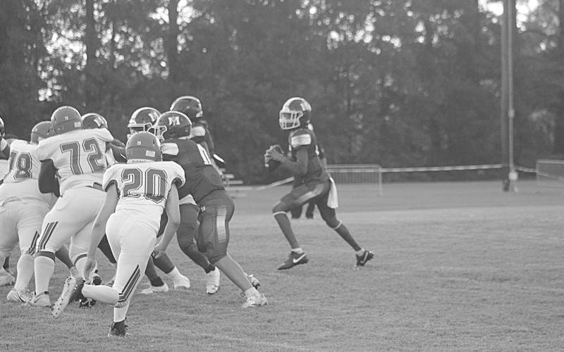 Mamou’s quarterback Jayden Ardoin (1) drops back to deliver a 35-yard touchdown strike to Zamaurri Brown. (Gazette photo by Tony Marks)