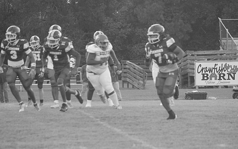 Keontez Campbell (7) scores a 42-yard touchdown against Bolton Academy to begin the regular season. (Gazette photo by Tony Marks)