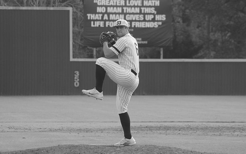 Sacred Heart starting pitcher Briggs Ardoin (6) makes his windup in a 92-pitch performance against Pine Prairie on Tuesday afternoon. (Gazette photo by Rhett Manuel)