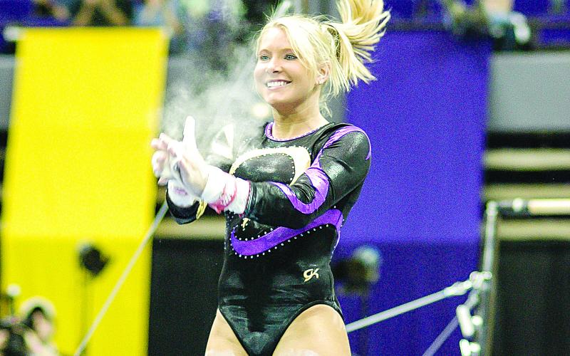 APRIL BURKHOLDER — Competed at LSU from 2003-06, graduating as the school’s most decorated gymnast and still ranking nearly two decades later among the elite in the program’s rich history. A 14-time All-American, she won 108 individual titles to set a school record, including the 2006 NCAA beam title with a score of 9.9125. (Photo courtesy of Louisiana Sports Hall of Fame)