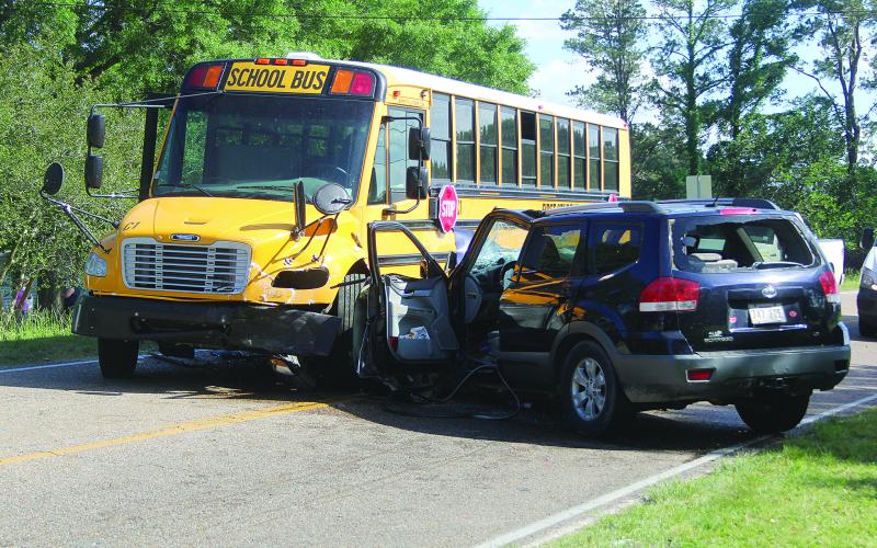 SUV collides with school bus
