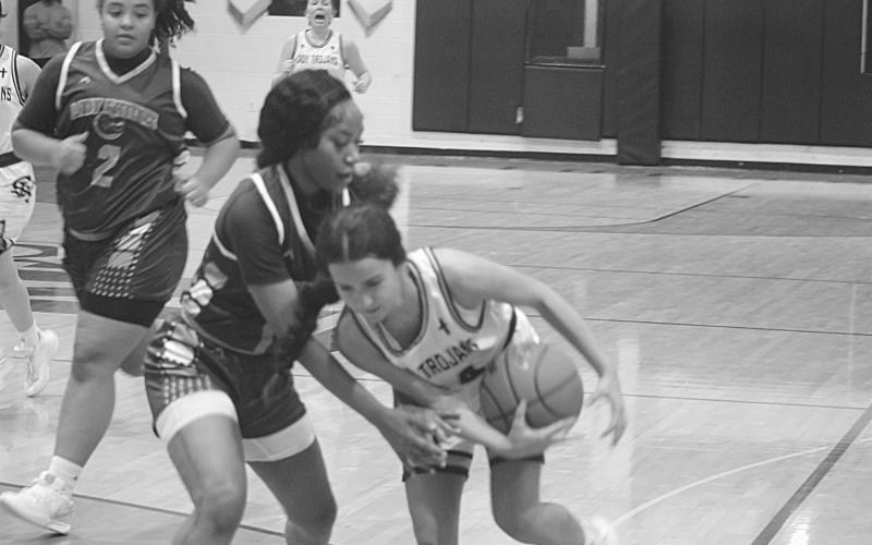 Riley St. Cyr (34) holds on to the basketball on her way to the net in Sacred Heart’s come-from-behind win against Beau Chene.