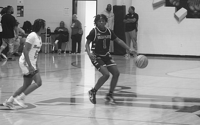 Britelah Freeman (1) moves the basketball across the midcourt line in the Ville Platte Lady Bulldogs’ win over Opelousas.