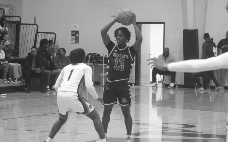 Britelah Freeman (1) moves the basketball across the midcourt line in the Ville Platte Lady Bulldogs’ loss against Opelousas.