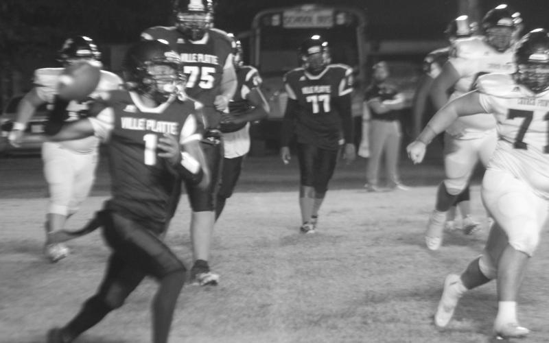Bulldog quarterback Jaquan Lavergne (1) looks to complete a pass against Church Point on Thursday night. Lavergne and the other seniors were honored during the course of the evening. (Gazette photo by Rhett Manuel)