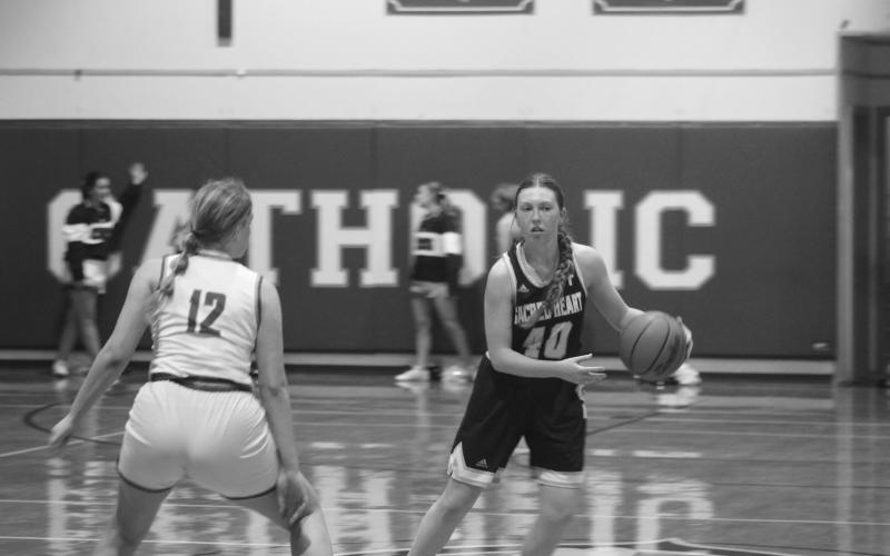 Rose Ardoin (40) moves the ball down the court in Sacred Heart’s 54-43 win over Catholic-Pointe Coupee in the first round of the girls’ basketball playoffs. (Gazette photo by Tony Marks)