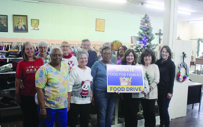 Pictured in no particular order are Eugene Fontenot and volunteers Monette Richardson, Anna Fontenot, Claudia Ortego, Rose Fontenot, Becky Miller, Darlene Soileau, Kaera Doucet, Mary Freeman, Melissa Arvie, Dorothy Griffin, and Sharlene Znamierowski. Not pictured is Eva Smith. (Gazette photo by Tony Marks)