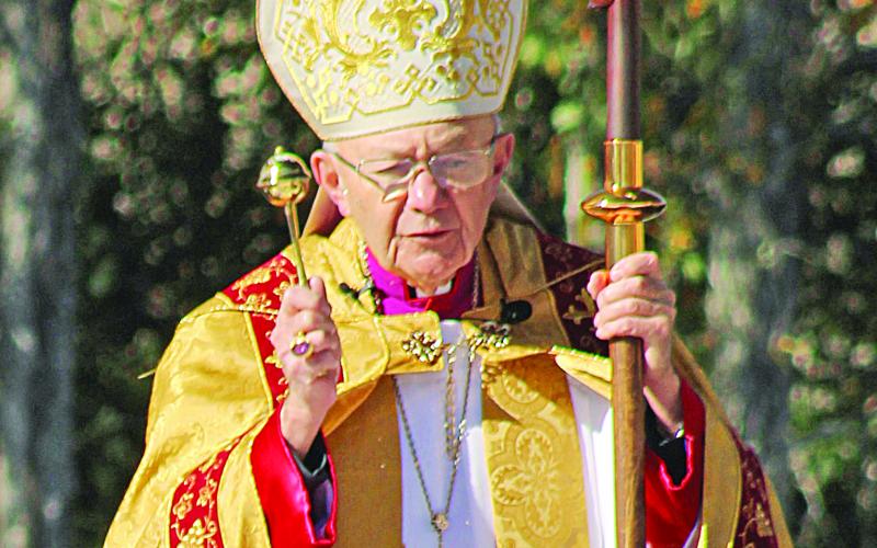 Bishop J. Douglas Deshotel of the Diocese of Lafayette blesses the three copies of the Acts of the Cause for the canonization.  (LSN photo by Claudette Olivier)