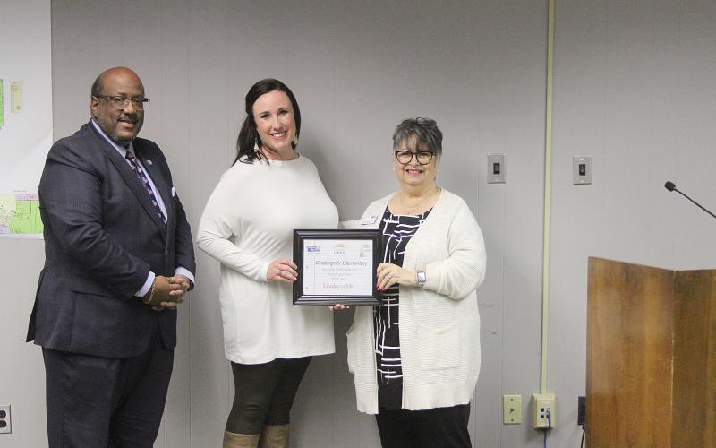 From left are Supt. Darwan Lazard, Chataignier Elementary Principal Sarah Hamlin LaFleur, and LeCompte. (Gazette photo by Tony Marks)
