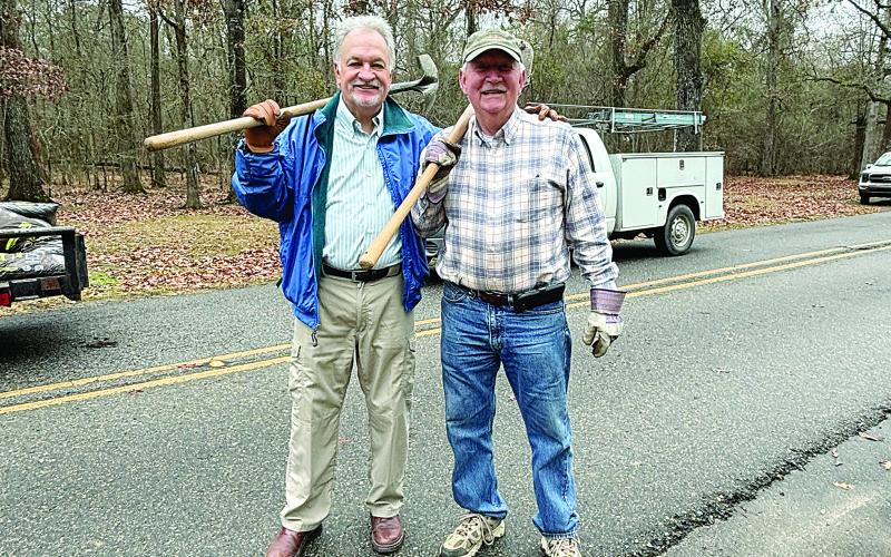 Rotarians Dr. William “Tojo” Ward (left) and Brent Coreil (right) are pictured with their shovels as they work at Chicot State Park on Tuesday, January 23. (Gazette photo by Heather Bogard)