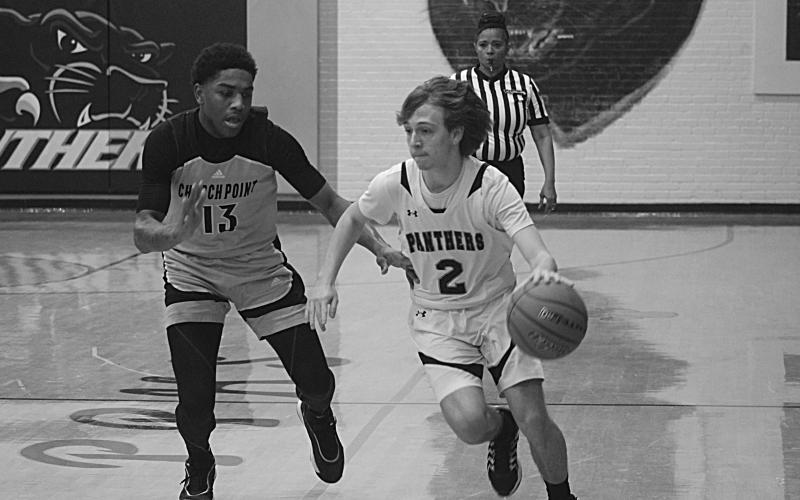 Julian Godeaux (2) tries to outrun a Church Point defender. He was one of three Panthers to score 4 points in an 87-21 loss. (Gazette photo by Tony Marks)
