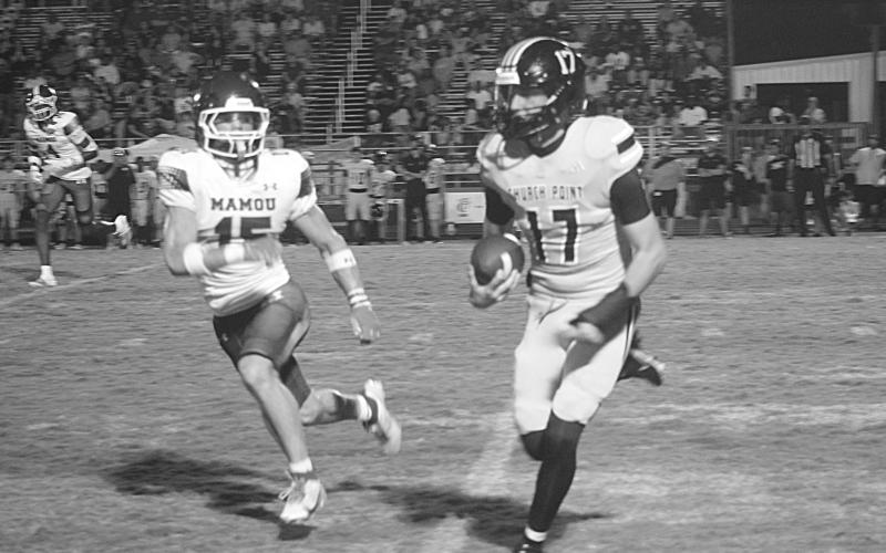 Mamou’s Payton Ashford (15) forces Church Point’s Luke Baudoin out of bounds in the Green Demons’ 41-18 loss to the Bears. (Gazette photo by Tony Marks)