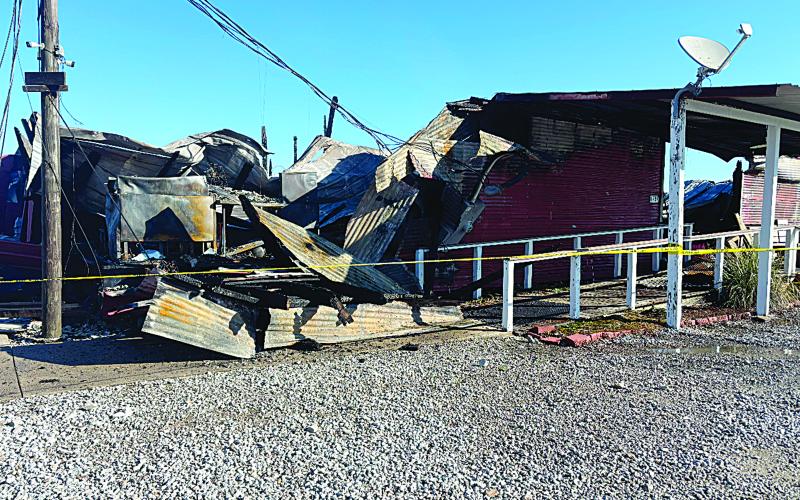 (Right photo) The Crawfish Barn is pictured after being destroyed by the fire. The cause of the fire remains under investigation. (Gazette photo by Heather Bogard)