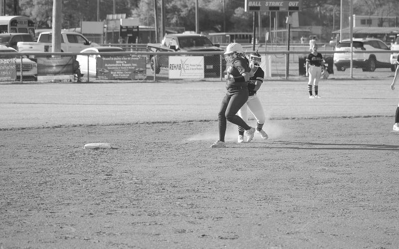 Danilynn Landreneau (27) tags a Crowley base runner out at second base in Mamou softball’s 11-1 win on Tuesday. (Gazette photo by Tony Marks)