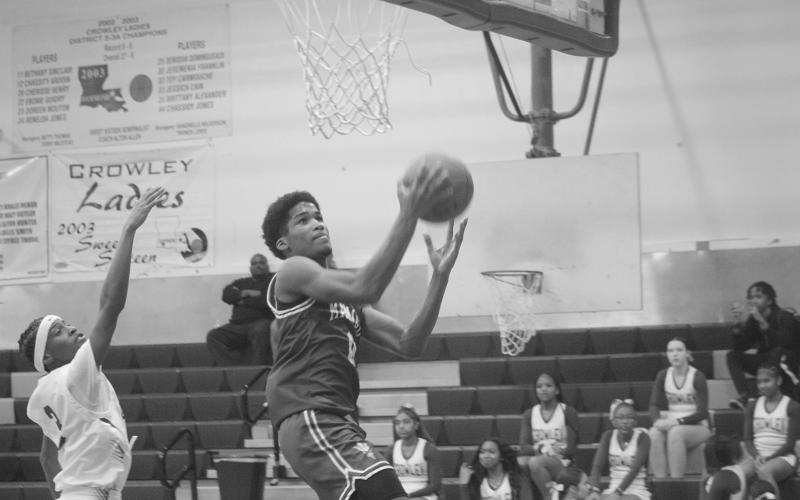 Ernest Dugas (0) goes up for a bucket in Mamou’s 75-54 win over Crowley. The win improved the team’s record to 20-4. (Gazette photo by Tony Marks)