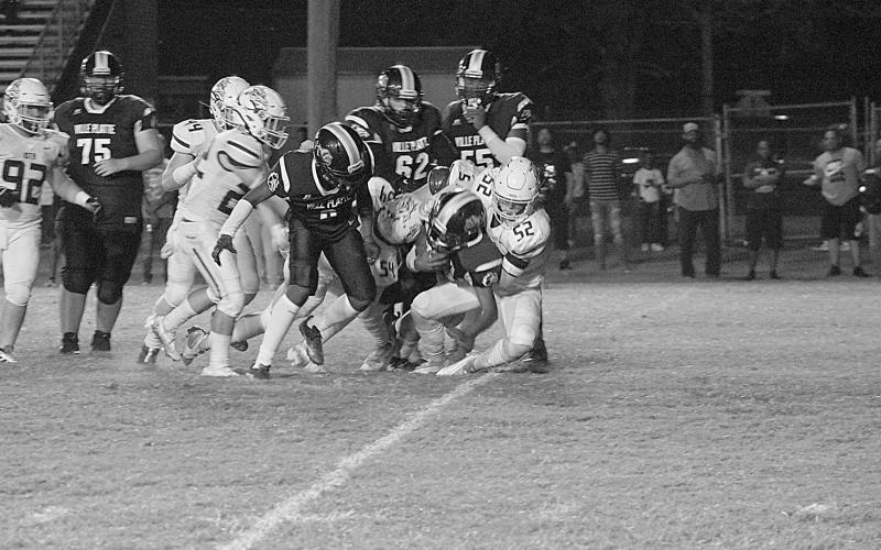 The Ville Platte High offense keeps churning against a vaunted Iota defense in a loss last week to open up district play. Coach Roy Serie’s Bulldogs will now take on Pine Prairie tonight. (LSN photo courtesy of Chris Quebedeaux)