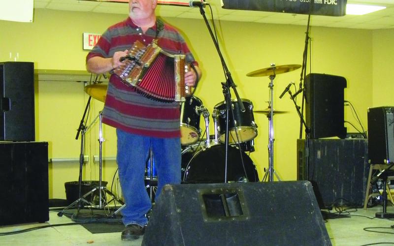 MUSICIAN IS HONORED - On September 17, Don Fontenot, of Don Fontenot and Les Amis de la Louisiane, was the special honoree during this year’s Mamou Cajun Music Festival. Fontenot is pictured here as he performs during the event. (Gazette photo by Heather Bogard)