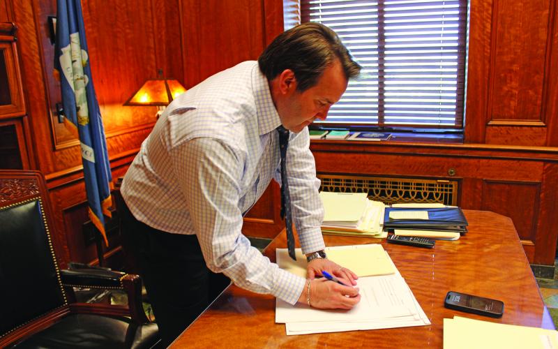 Speaker of the House of Representatives Phillip DeVillier signs bills that were passed in the House on Monday, March 18. The 2024 regular legislative session began Monday, March 11. (LSN photo by Claudette Olivier)