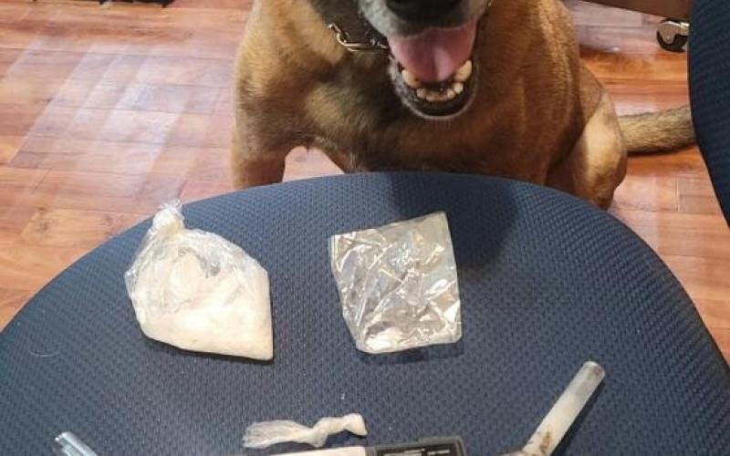 The Evangeline Parish Sheriff’s Department’s K-9 Officer Diego is pictured with items seized following a recent arrest that resulted from a traffic stop on Steven Chad Babineaux, of Eunice. (Photo submitted)