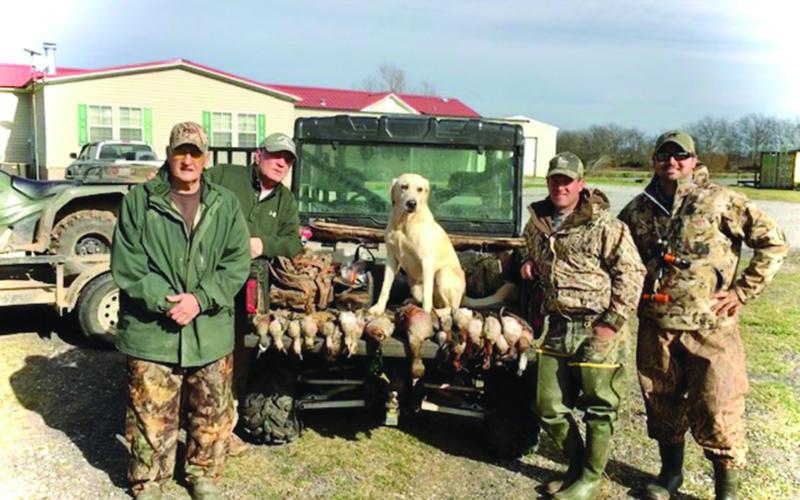 Pictured from left are James C. “Dino” Fontenot, Timmy Sylvester, Dr. Brandon Fontenot, and Mike Poole following a duck hunt years ago. (Photo courtesy of Dr. Brandon Fontenot)