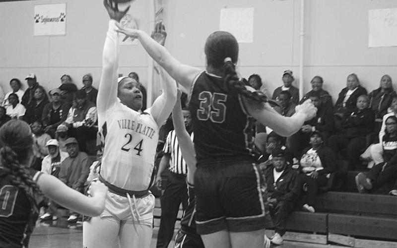 Derriell Freeman (24) attempts a basket for the Lady Bulldogs in their overtime win against Doyle on Monday night. With the win, Ville Platte advanced to the quarterfinals for the first time in 9 years. (Gazette photo by Tony Marks)