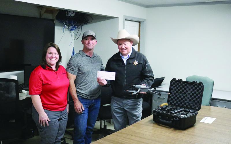 Pictured from left are Molly Smith and Shannon Trahan, both of Kinder Morgan, and Evangeline Parish Sheriff Charles Guillory. (Gazette photo by Tony Marks)