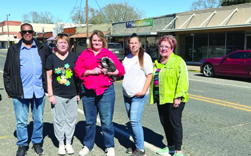 From left are Greg Colbert and Lori Horne with Scooby Dew Rescue along with Gail Peacock from Hotel Cazan, Jenn Shaw from EPAR, and Camille Fontenot from Hotel Cazan. Scooby Dew Rescue received its 501c3 status last fall and had assisted and or rescued close to 300 dogs and several cats. (Gazette photo by Tony Marks)