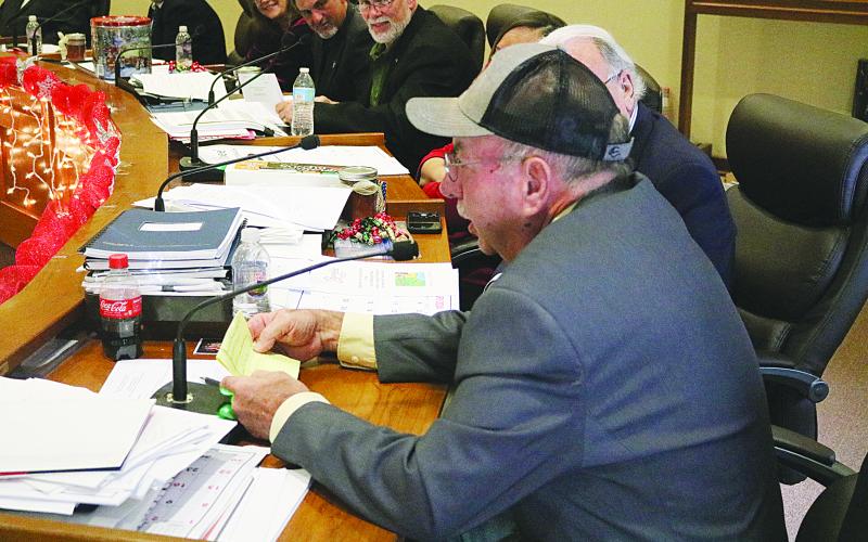 Evangeline Parish Police Juror from District 2 Sidney Fontenot reads the engineer’s report en français for parish engineer Ronnie Landreneau during the French meeting held Tuesday, December 12. (Gazette photo by Tony Marks)