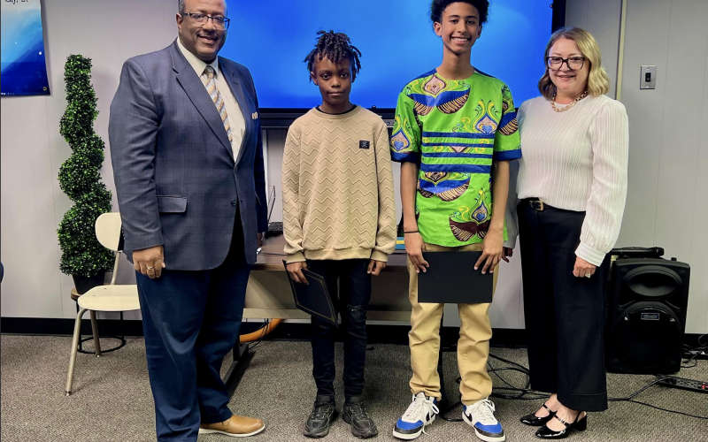 From left are Superintendent Darwan Lazard; Jaiden Thomas, 5th grade student of the year from James Stephens Montessori; Ethan Zang, 8th grade student of the year from Evangeline Reimagine Academy; and Supervisor Cheri Fontenot. Not present was Charlee Smith, 12th grade student of the year from Basile High School. (Gazette photo by Nancy Duplechain)