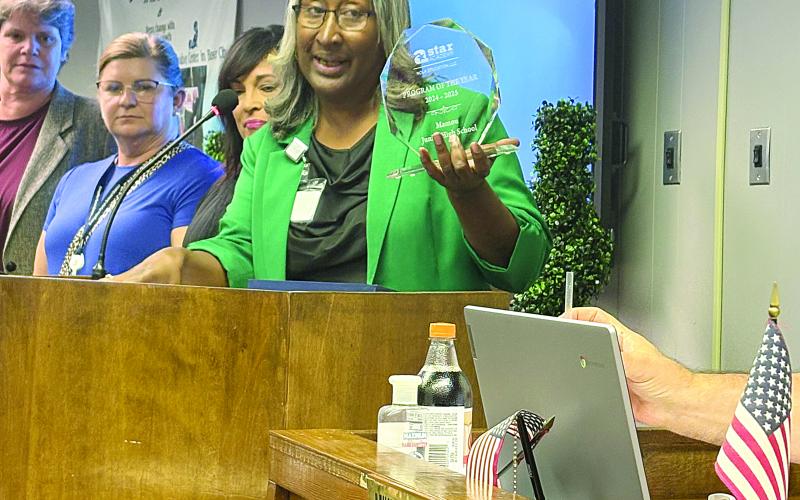 Mamou Junior High School Principal Lisa Celestine displays the school’s award for being named 2024-2025 Star Academy National Program of the Year. (Gazette photos by Tony Marks)