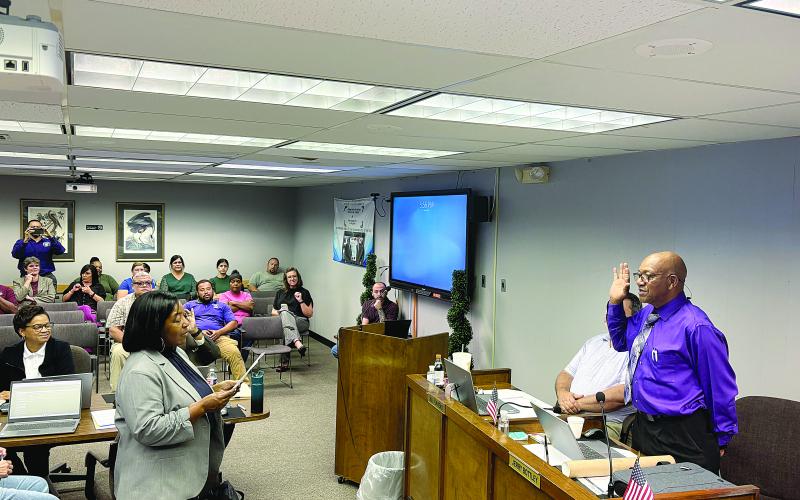 Jerry Bottley (right) takes the oath of office from Assistant District Attorney Betsy Jackson (left). Bottley was elected in October in a special election to fill the unexpired term of Wanda Skinner to represent District 8 of the Evangeline Parish School Board.