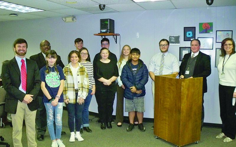 Pictured with Evangeline Parish Superintendent Darwan Lazard, Assistant Superintendent Michael Lombas, and Pine Prairie Principal Alice Lejeune are the honor band students from Pine Prairie and Bayou Chicot. In no particular order are Kurt Agdon, Luke Chapman, Grace Bordelon, Koby Smith, Madison West, Julie Mabe, Raeanna Fontenot, and Adyson West. Also pictured are band directors John Havard and Kevin Naquin. (Gazette photo by Tony Marks)