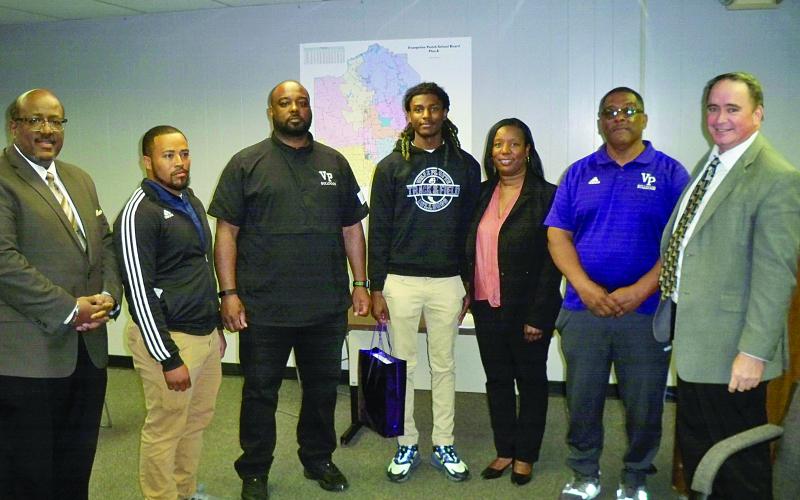 Pictured from left are Superintendent Lazard, Coach Benjamin Joseph, Coach Launey Coward, Michael Berry, VPHS Principal Tezeno, Coach Roy Serie, and Assistant Superintendent Lombas. (Gazette photo by Tony Marks)