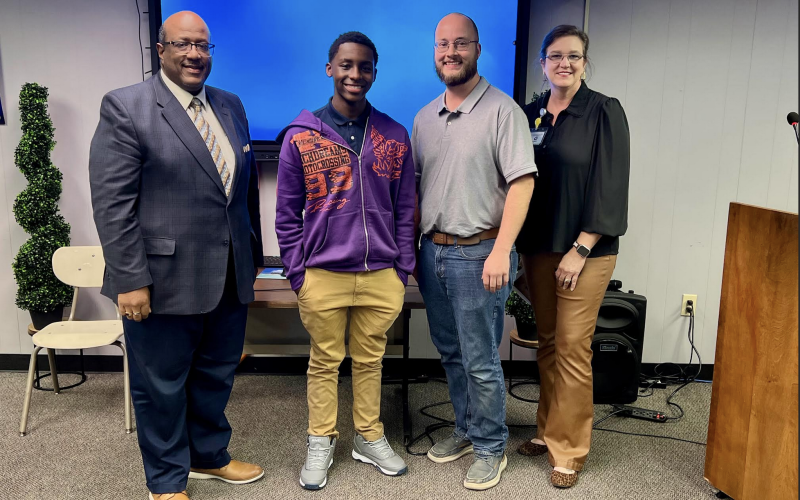 From left are Superintendent Darwan Lazard, E-Sports Qualifier Jayden Chaney, Stephen LaCaze, and Evangeline Reimagine Academy Principal Alice LeJeune. (Gazette photo by Nancy Duplechain)