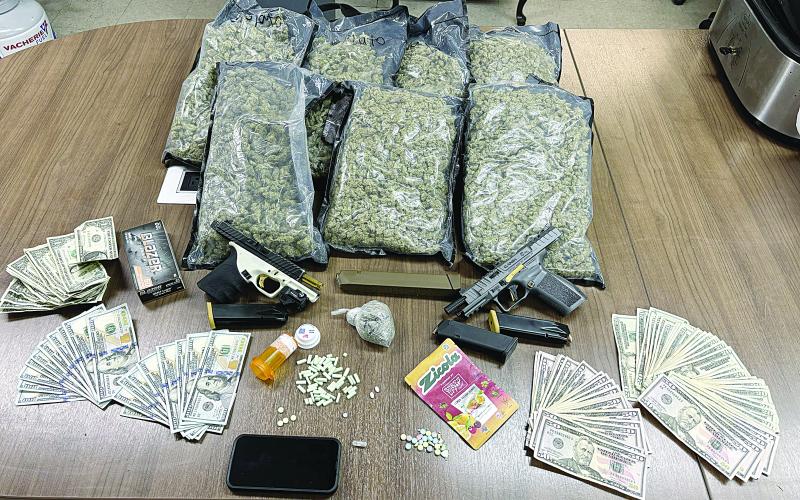 Pictured are narcotics, weapons, and other items that were seized following an Evangeline Parish Sheriff’s Office arrest. (Photo courtesy of EPSO)
