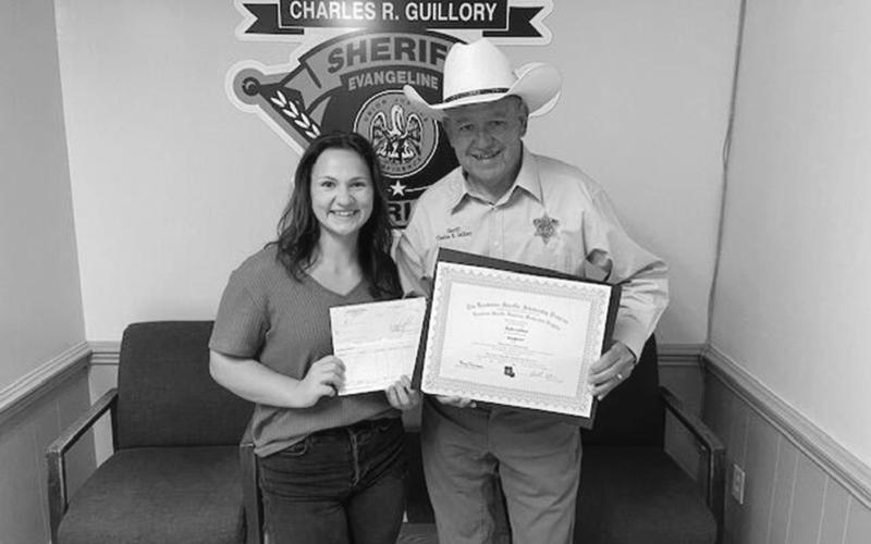 Ricki Lafleur (left) is pictured with Evangeline Parish Sheriff Charles Guillory after receiving an academic scholarship from the Louisiana Sheriff’s Scholarship Program. (Photo courtesy of EPSO)