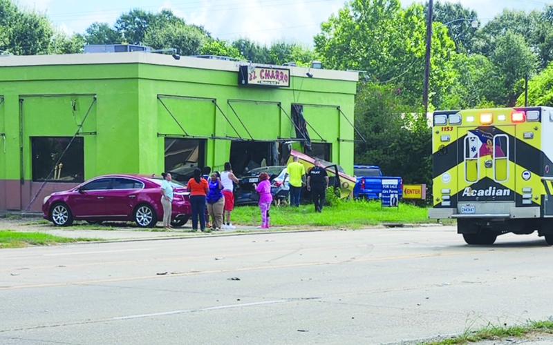Car runs into vacant building
