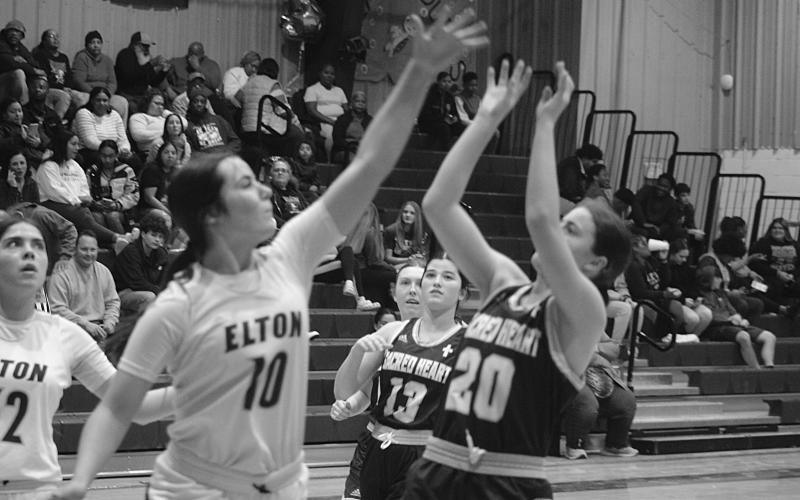 Sacred Heart’s Alyssa Brignac (20) finishes her shot in a win against Elton on Thursday night. (Gazette photo by Tony Marks)